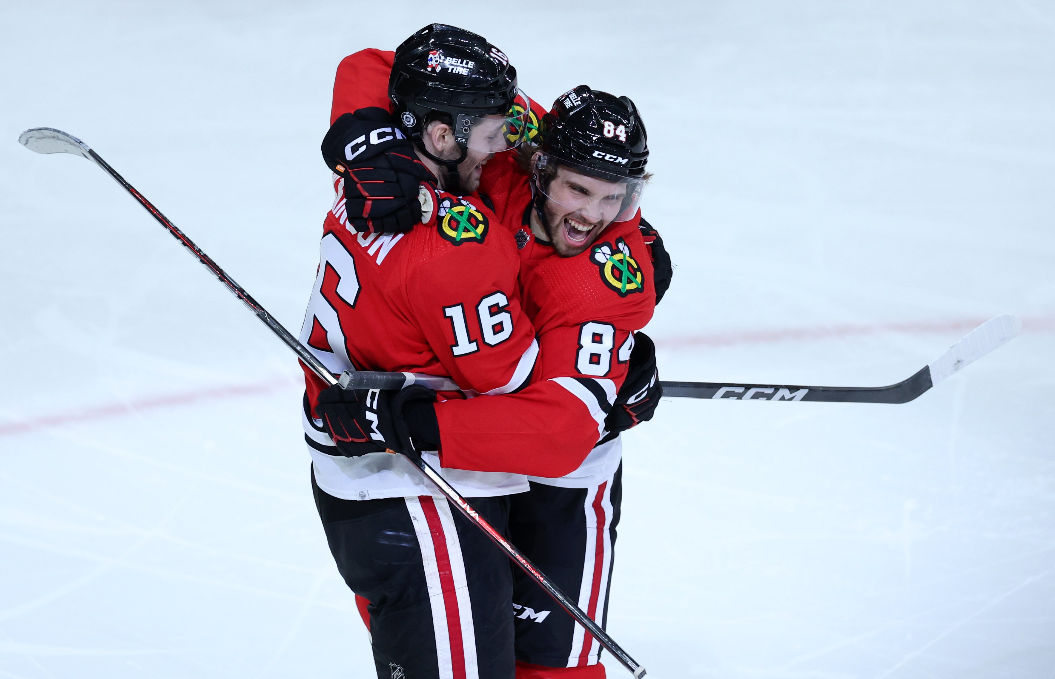 Chicago Blackhawks center Jason Dickinson (16) and left wing Landon Slaggert (84) celebrate after Slaggert thought he scored in the third period of a game against the Calgary Flames at the United Center in Chicago on March 26, 2024. After a review, the goal was disallowed. (Chris Sweda/Chicago Tribune)