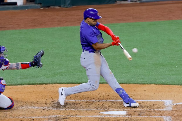 Chicago Cubs' Christopher Morel singles against the Texas Rangers during the fourth inning of a baseball game Thursday, March 28, 2024 in Arlington, Texas. (AP Photo/Gareth Patterson)