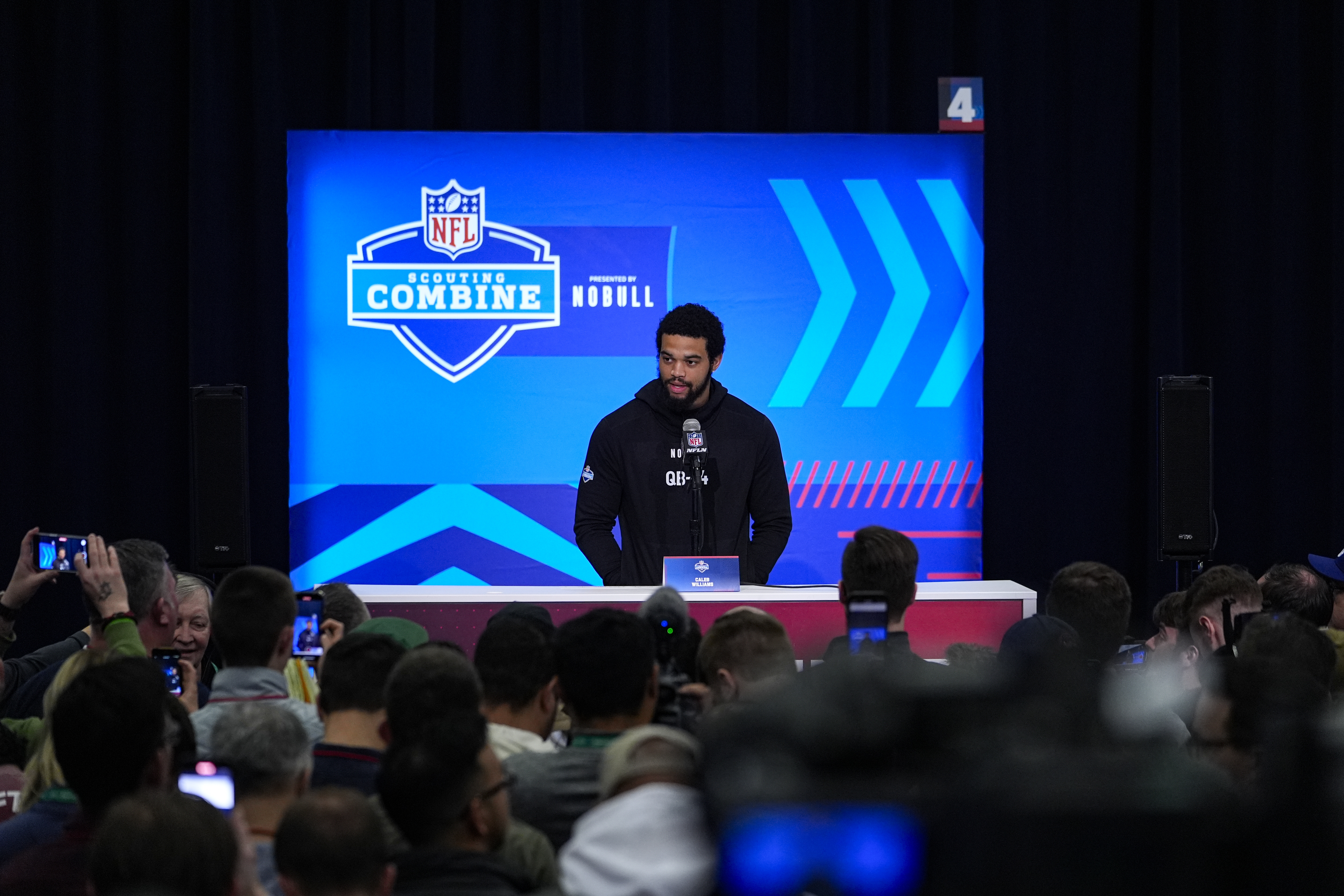 USC quarterback Caleb Williams speaks at the NFL combine in...