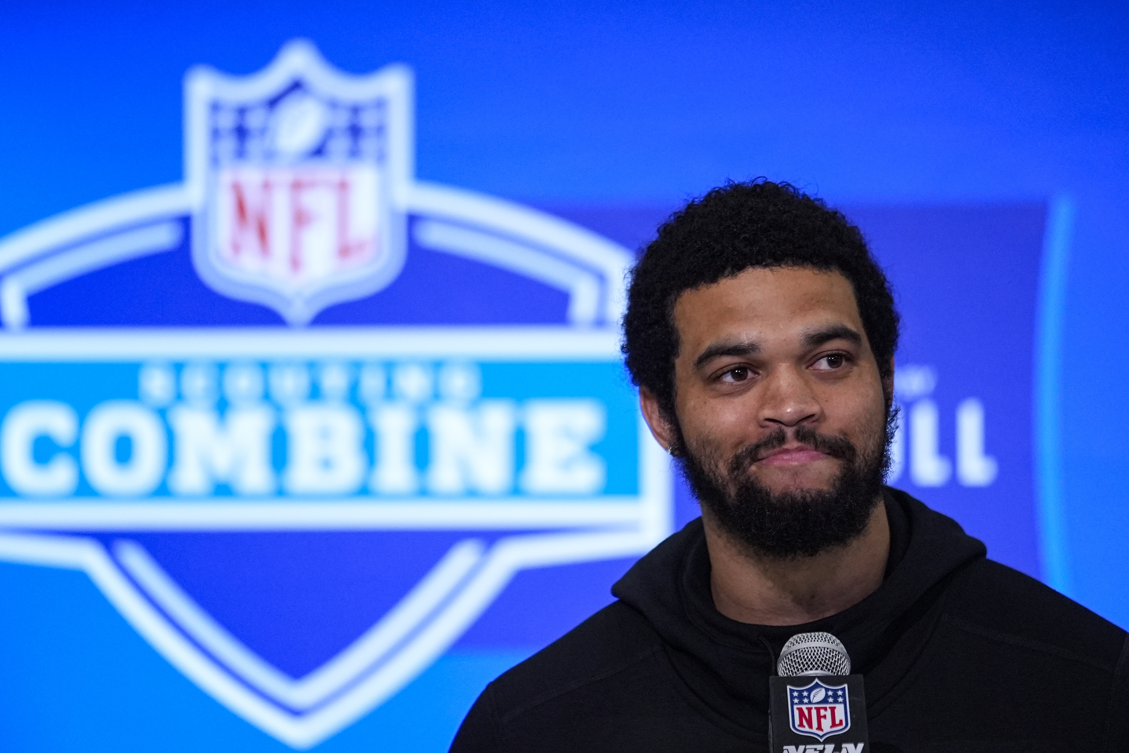 USC quarterback Caleb Williams speaks at the NFL combine in...