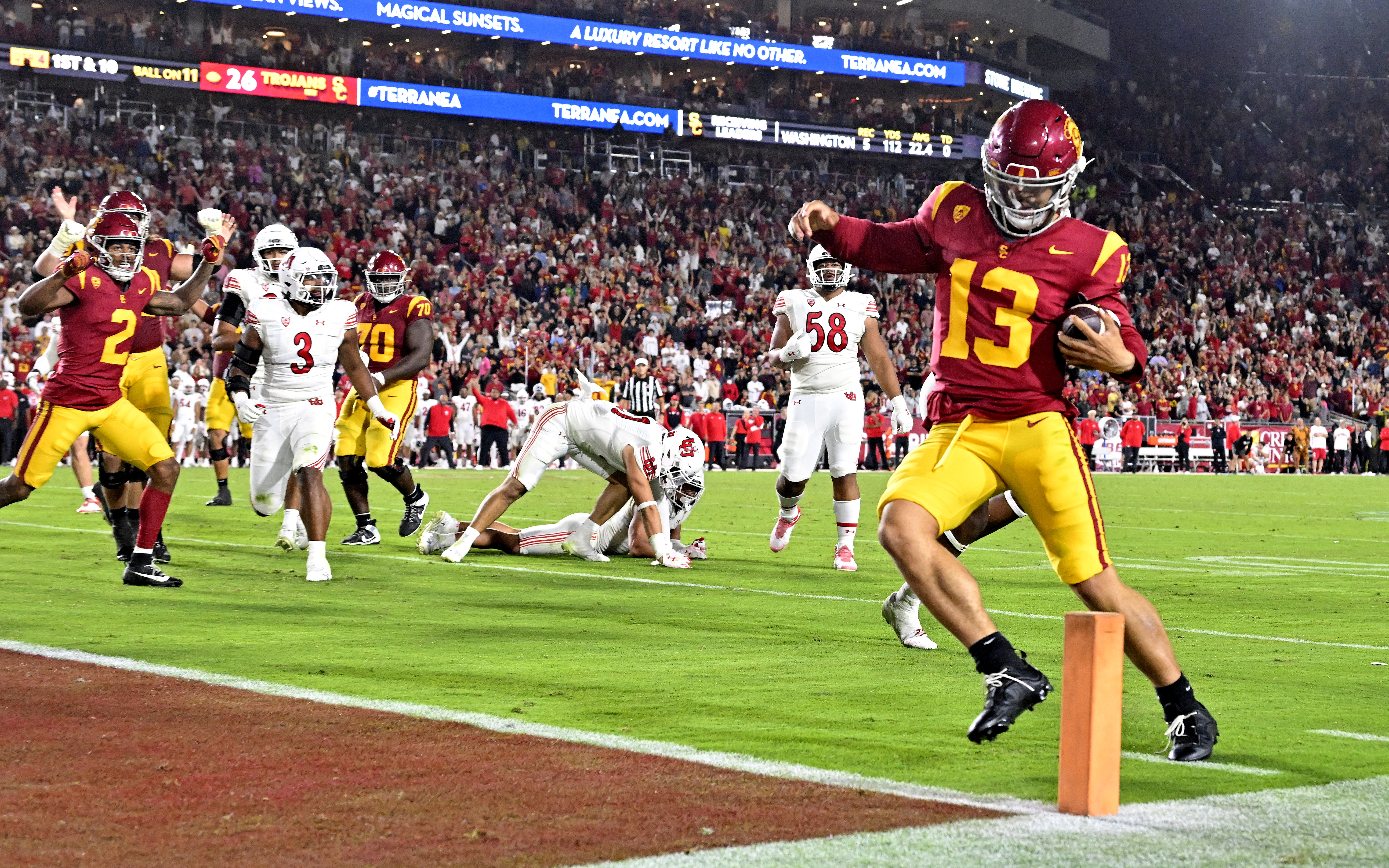 Quarterback Caleb Williams runs for a touchdown against Utah on...