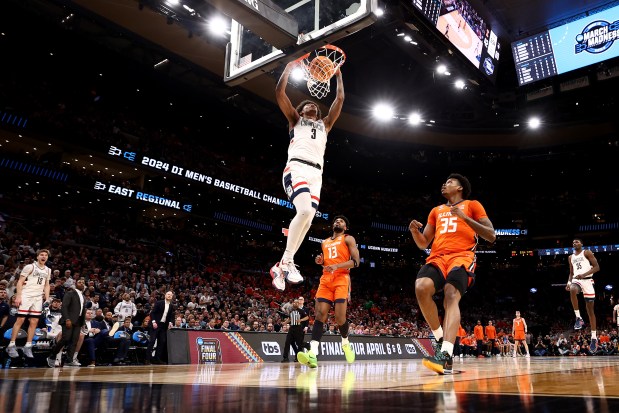 BOSTON, MASSACHUSETTS - MARCH 30: Jaylin Stewart #3 of the Connecticut Huskies dunks the ball against the Illinois Fighting Illini during the second half in the Elite 8 round of the NCAA Men's Basketball Tournament at TD Garden on March 30, 2024 in Boston, Massachusetts. (Photo by Maddie Meyer/Getty Images)