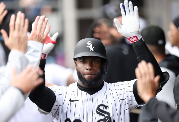 White Sox center fielder Luis Robert Jr. celebrates after hitting a two-run home run against the Tigers in the first inning at Guaranteed Rate Field on March 30, 2024, in Chicago. (John J. Kim/Chicago Tribune)