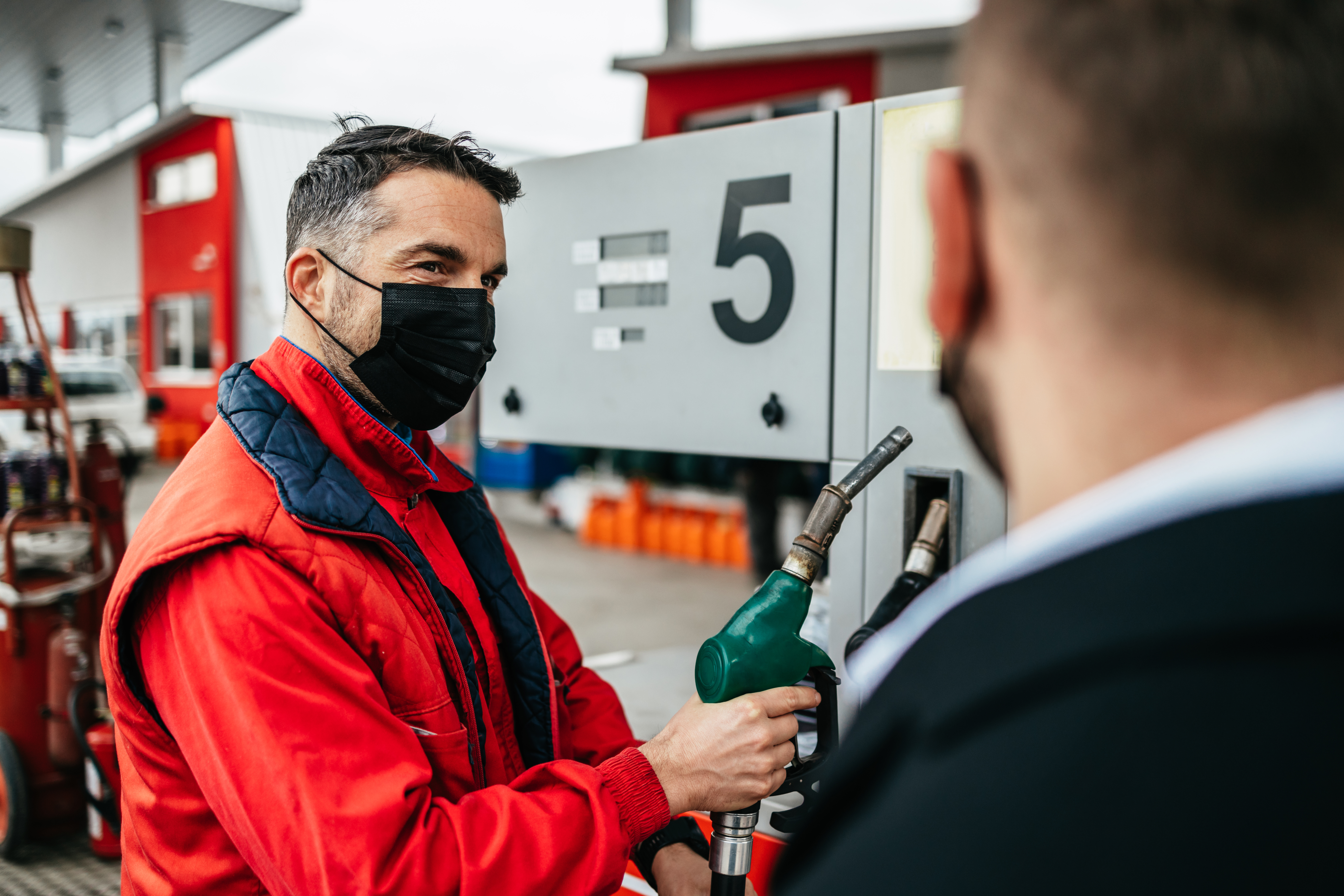 guy holding a gas pump