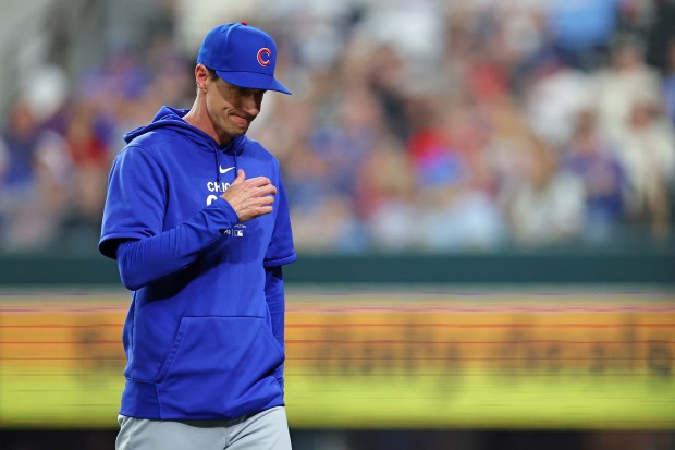 Cubs manager Craig Counsell walks to the dugout during the fourth inning against the Rangers on March 30, 2024, in Arlington, Texas. (Stacy Revere/Getty)