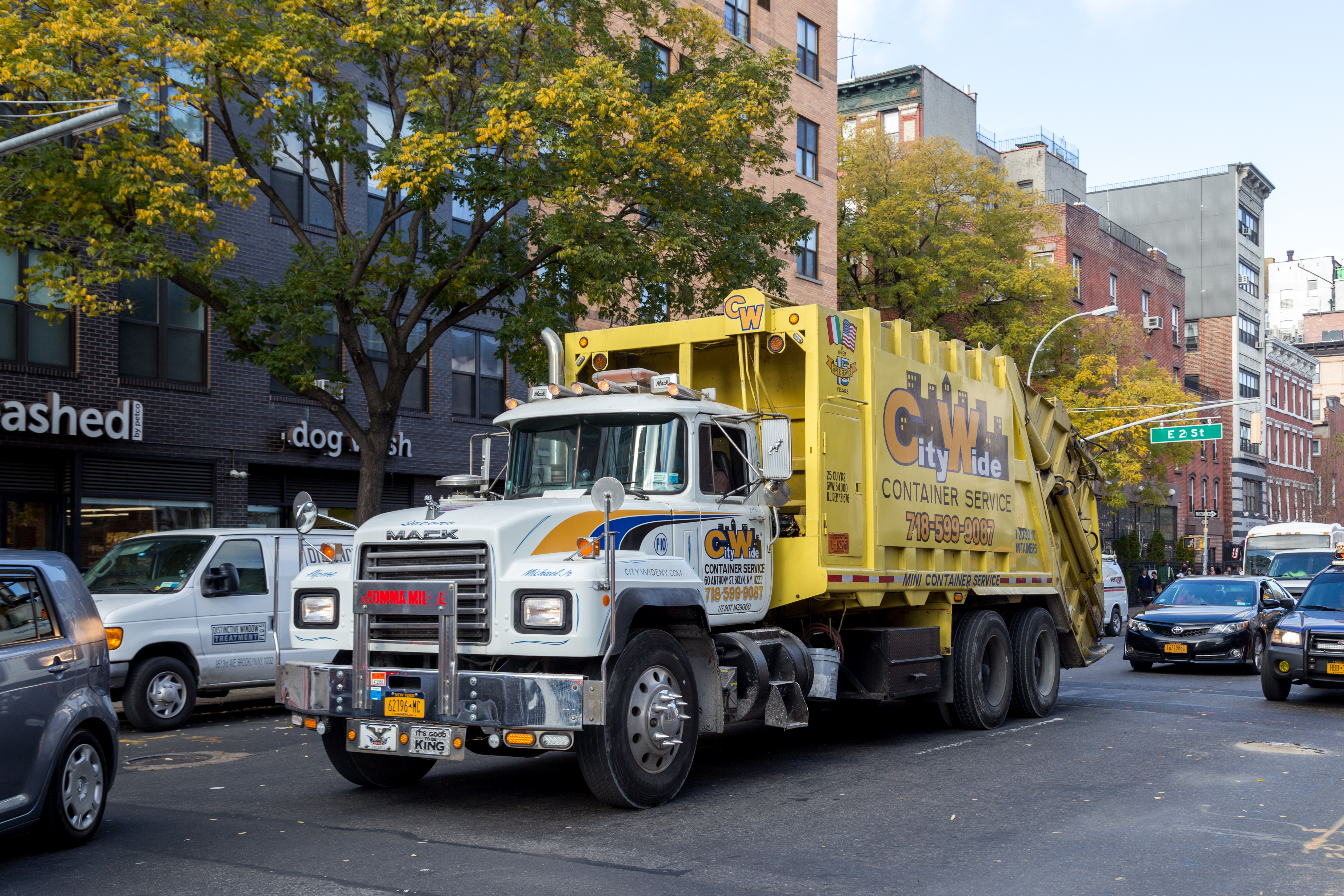 A garbage truck in the city.