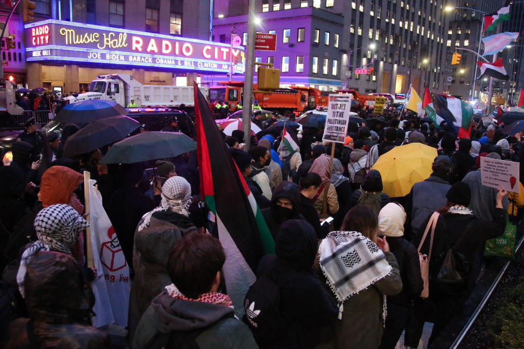 Protestors crowd outside of Radio City Music Hall where President Joe Biden is holding a fundraiser.