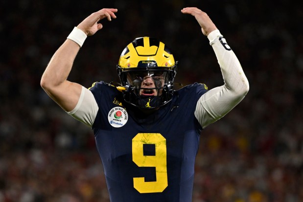 Michigan quarterback J.J. McCarthy reacts after running back Blake Corum scored a touchdown during overtime of the Rose Bowl against Alabama on Jan. 1, 2024, in Pasadena, Calif. (AP Photo/Kyusung Gong)