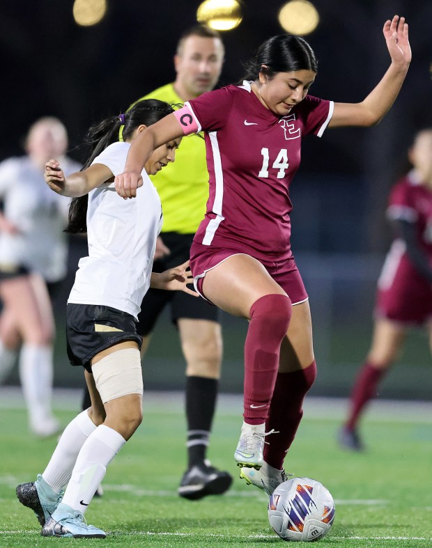 Elgin's Dahlia Perez (14) steals the ball from Glenbard North's Giselle Figueroa Ortiz (7) during an Upstate Eight Conference match on Tuesday, April, 9, 2024. Match ended in a scoreless tie.H. Rick Bamman / For the Beacon News