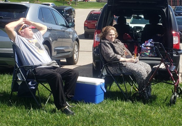 Kirk and Marietta Guesbeck of Sellersburg tailgate Monday outside Memorial Stadium in Bloomington for the eclipse. (Carrie Napoleon/Post-Tribune)