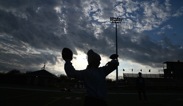 Casey Levy, 13, a Northbrook seventh-grader, handles the ball during a GBN Jr. Spartan Football clinic at William Lutz Stadium at Glenbrook North High School on April 7, 2024. (Karie Angell Luc/Pioneer Press)