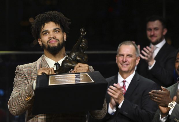 Southern California quarterback Caleb Williams holds the Heisman Trophy after winning the award, Dec. 10, 2022, in New York. (Todd Van Emst/Heisman Trophy Trust)