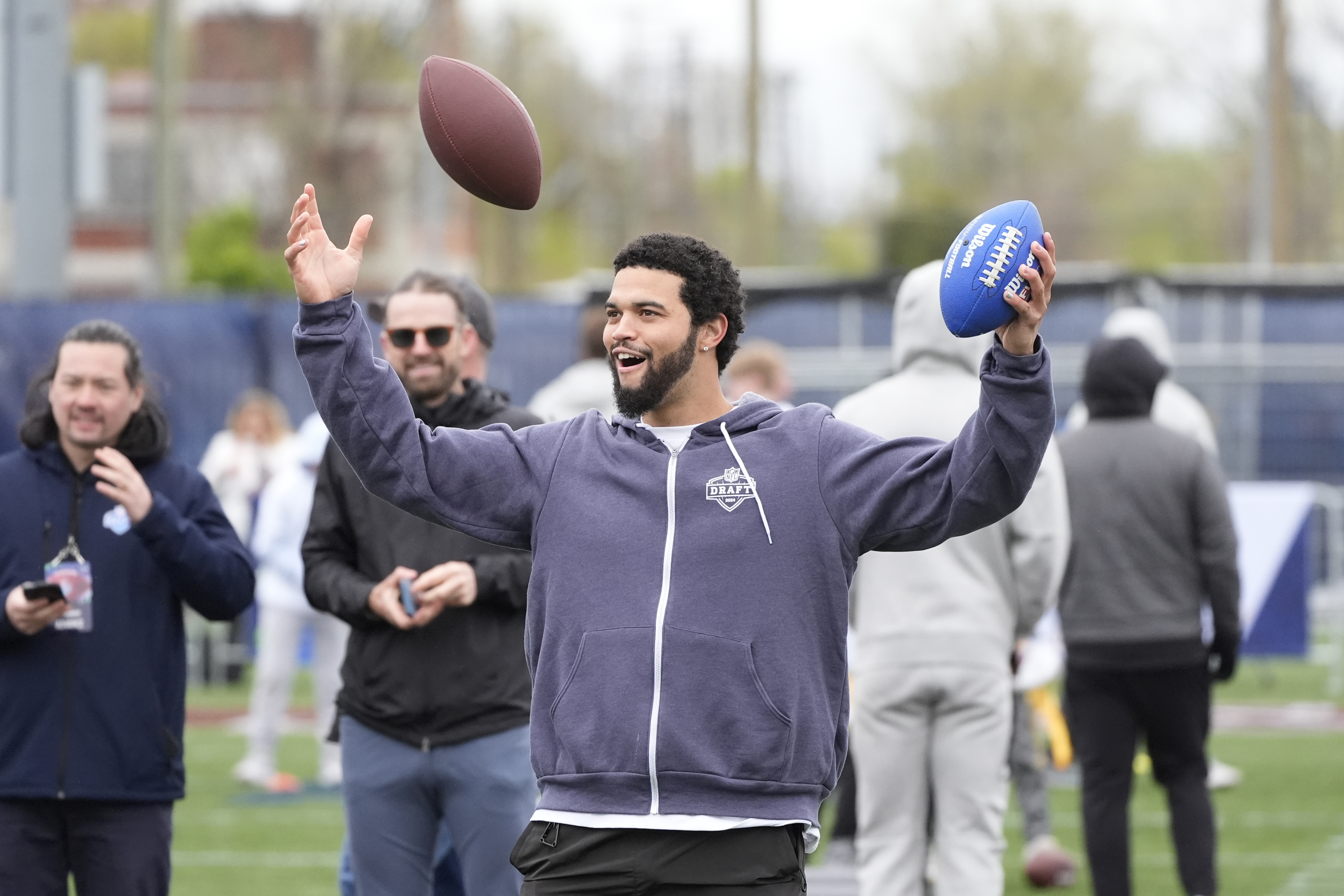 Quarterback Caleb Williams reacts after a throw during an NFL...