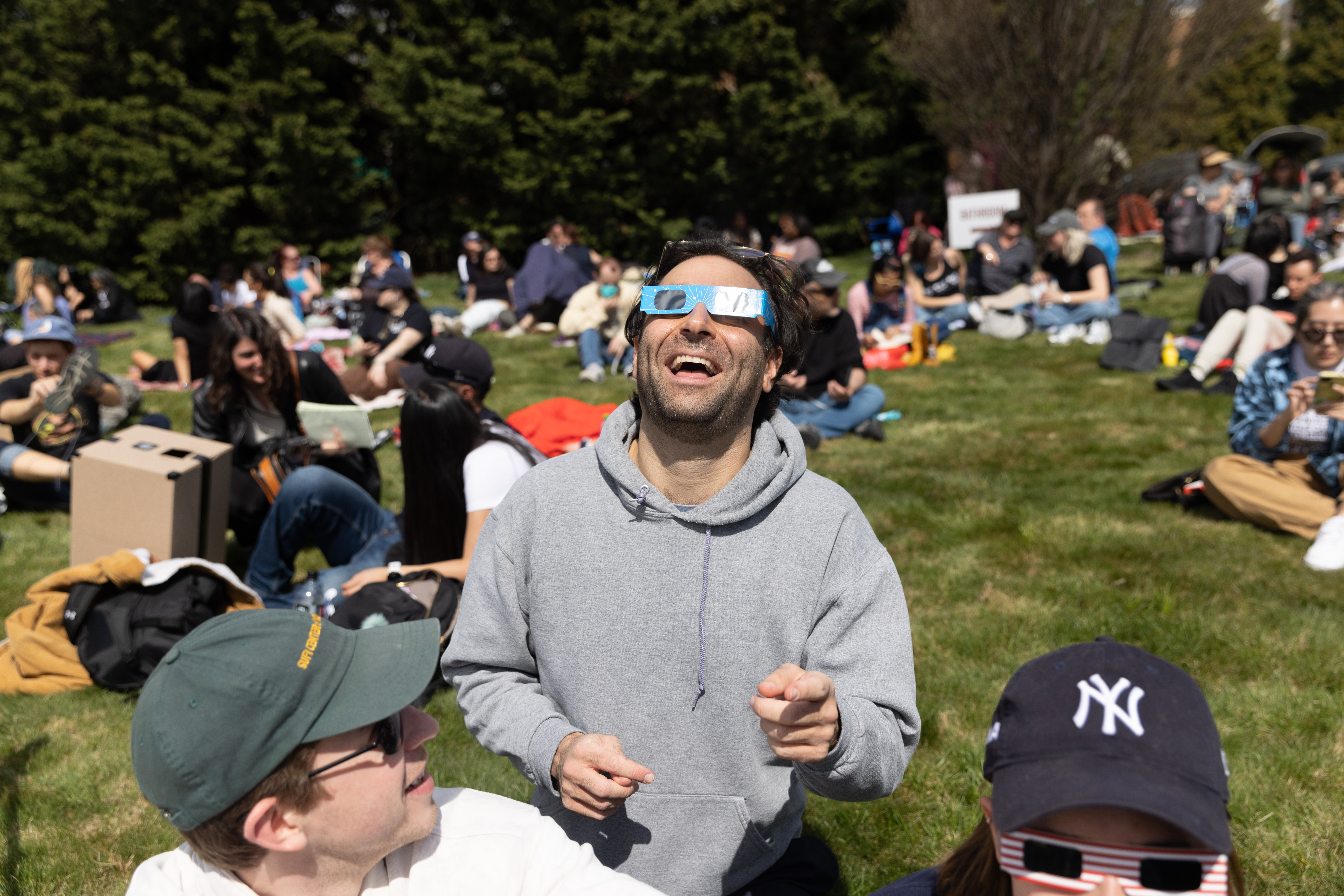 People view the Aril 8 eclipse at Green-Wood Cemetery in Brooklyn