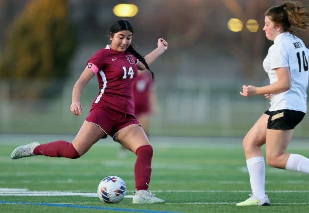 Elgin's Dahlia Perez (14) takes a shot against Glenbard North's Kaylee Hesik (10) during an Upstate Eight Conference match on Tuesday, April, 9, 2024. Match ended in a scoreless tie.H. Rick Bamman / For the Beacon News