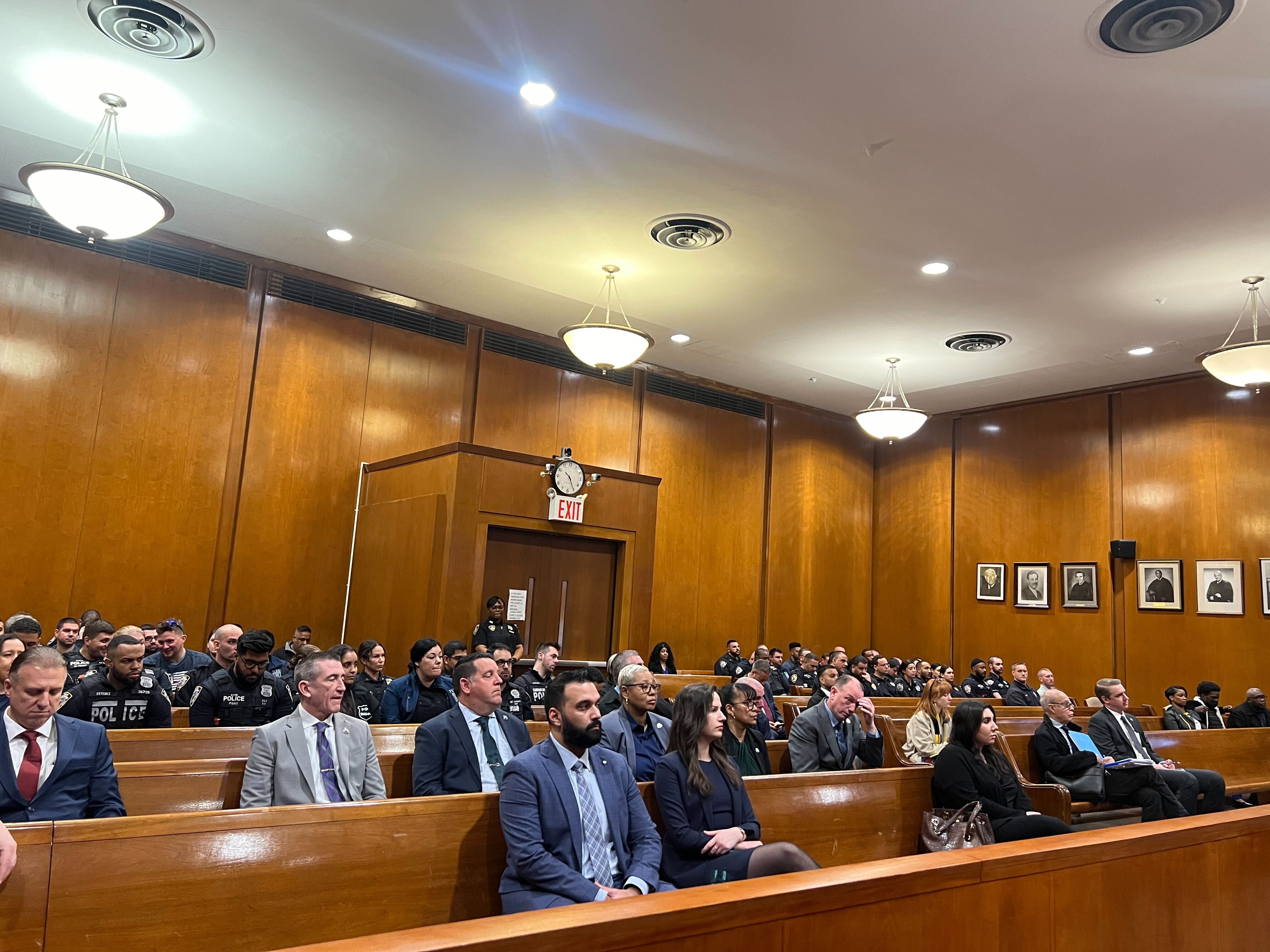 About a hundred police officers filled the gallery of a Queens courtroom where Lindy Jones was arraigned Tuesday.