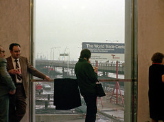 Rain and fog during the opening day of the World Trade Center. Several employees chat in the main lobby of the North Tower. April 4 1973.