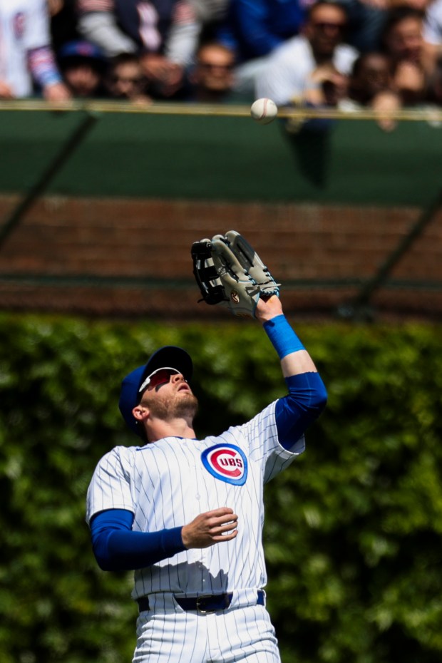 Chicago Cubs outfielder Ian Happ (8) catches a fly ball during the second inning against the Milwaukee Brewers at Wrigley Field on May 5, 2024. (Eileen T. Meslar/Chicago Tribune)