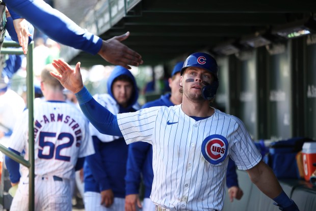 Chicago Cubs second baseman Nico Hoerner (2) celebrates after scoring a run on a wild pitch after getting a two-RBI double during the fifth inning against the Milwaukee Brewers at Wrigley Field on May 5, 2024. (Eileen T. Meslar/Chicago Tribune)