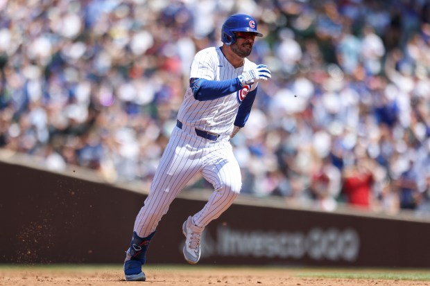 Chicago Cubs outfielder Mike Tauchman runs to third base during the third inning against the Pittsburgh Pirates at Wrigley Field on May 19, 2024. (Eileen T. Meslar/Chicago Tribune)