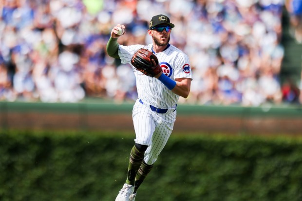 Chicago Cubs second base Miles Mastrobuoni (20) throws to first base during the eighth inning against the Pittsburgh Pirates at Wrigley Field on May 19, 2024. (Eileen T. Meslar/Chicago Tribune)