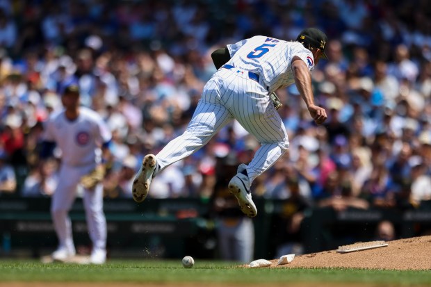 Chicago Cubs third base Christopher Morel (5) mishandles a grounder during the third inning against the Pittsburgh Pirates at Wrigley Field on May 19, 2024. (Eileen T. Meslar/Chicago Tribune)