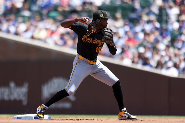 Pittsburgh Pirates shortstop Oneil Cruz (15) tries to turn two during the first inning against the Chicago Cubs at Wrigley Field on May 19, 2024. (Eileen T. Meslar/Chicago Tribune)