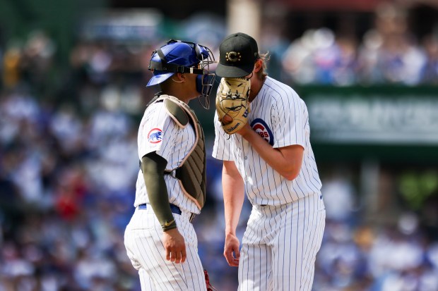 Chicago Cubs catcher Miguel Amaya speaks to pitcher Ben Brown during the eighth inning against the Pittsburgh Pirates at Wrigley Field on May 19, 2024. (Eileen T. Meslar/Chicago Tribune)