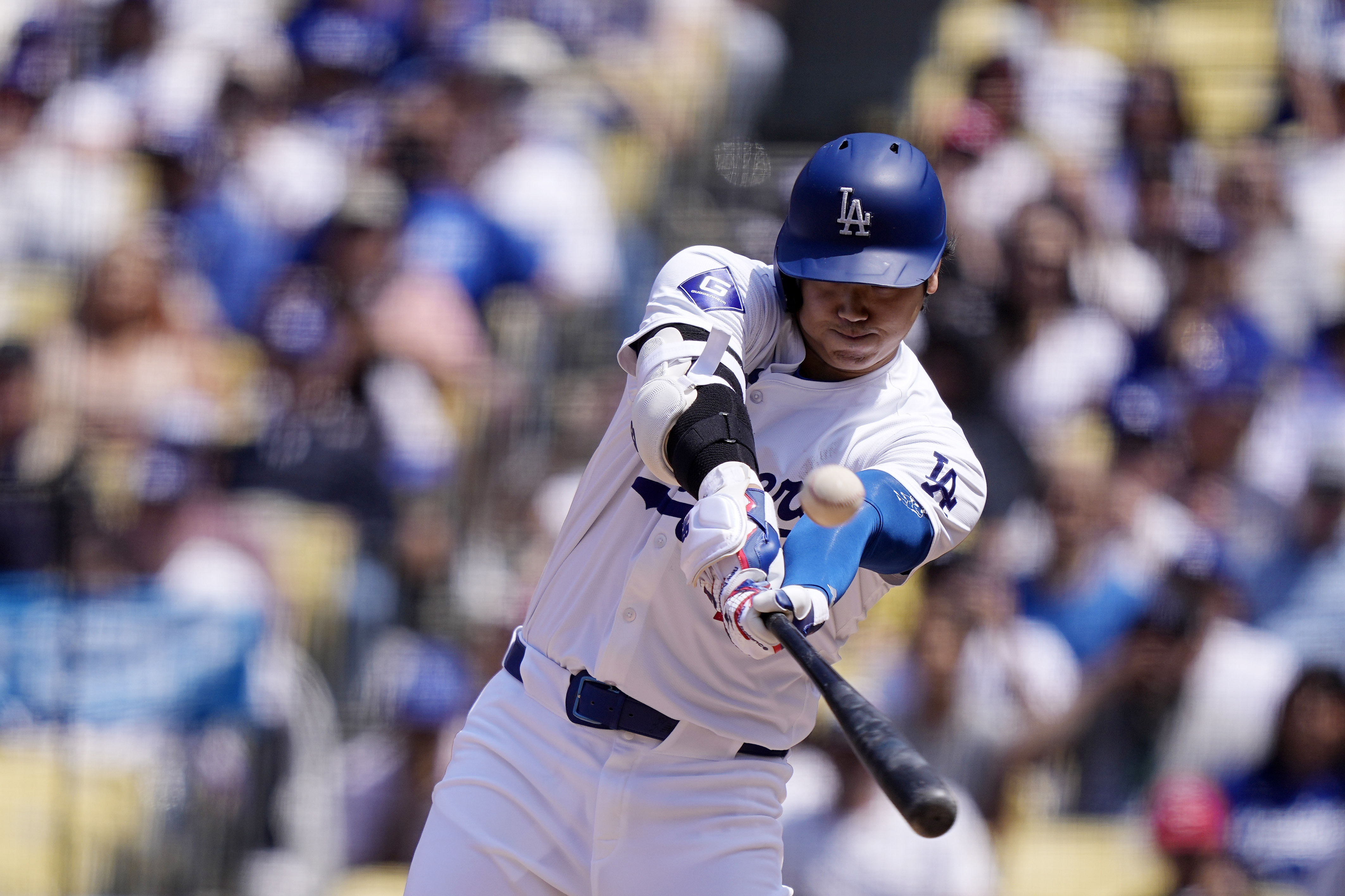 Los Angeles Dodgers’ Shohei Ohtani hits a foul ball during...