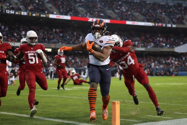 Bears running back Khalil Herbert runs for a touchdown against the Cardinals on Dec. 24, 2023, at Soldier Field. (Trent Sprague/Chicago Tribune)