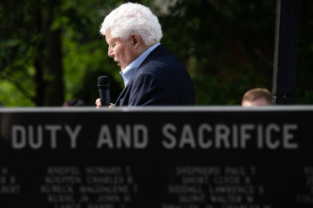 U.S. Army veteran Doug Pierce reads off the names of local fallen soldiers during Valparaiso's Memorial Day event on Friday, May 24, 2024. (Kyle Telechan/for the Post-Tribune)