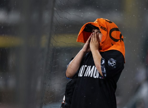 An Orioles fan yells chants in the rain in the eighth inning against the White Sox at Guaranteed Rate Field on May 24, 2024, in Chicago. (John J. Kim/Chicago Tribune)