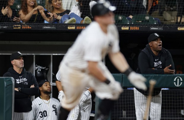 White Sox manager Pedro Grifol, from left, right fielder Corey Julks (30), and hitting coach Marcus Thames watch as first baseman Andrew Vaughn hits a home run in the seventh inning against the Orioles at Guaranteed Rate Field on May 24, 2024, in Chicago. (John J. Kim/Chicago Tribune)