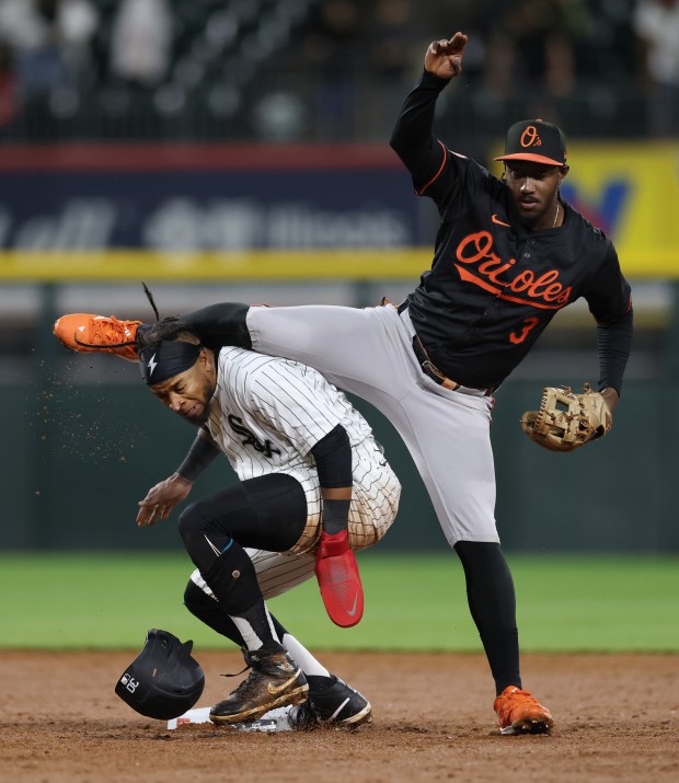 White Sox right fielder Corey Julks (30), left, collides with the leg of Orioles second baseman Jorge Mateo (3) as Henderson completes a double play in the eighth inning at Guaranteed Rate Field on May 24, 2024, in Chicago. (John J. Kim/Chicago Tribune)