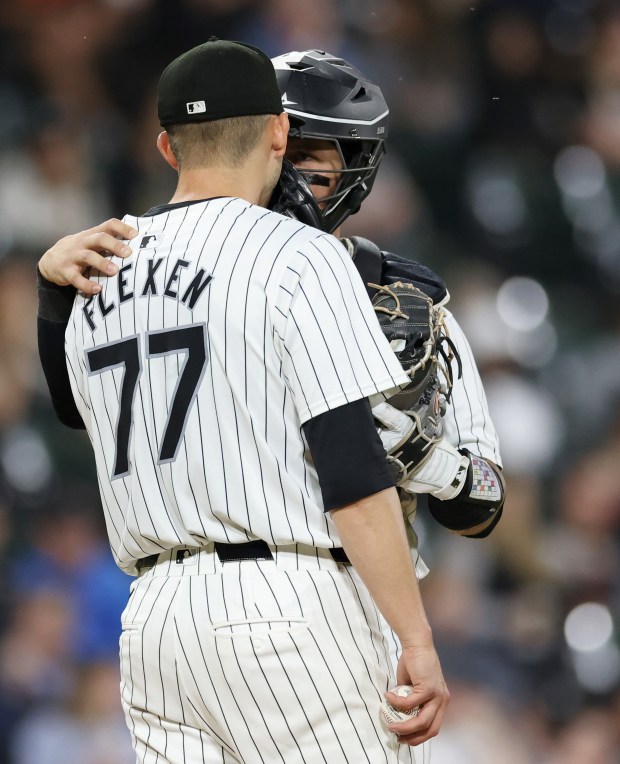 White Sox catcher Korey Lee (26), right, has an up-close talk with pitcher Chris Flexen (77) on the mound in the fifth inning against the Orioles at Guaranteed Rate Field on May 24, 2024, in Chicago. (John J. Kim/Chicago Tribune)