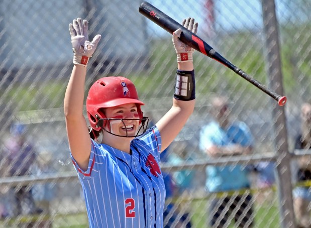 West Aurora's Mia Malczyk cheers as Sara Tarr is brought home with a sacrifice fly. West Aurora lost to Wheaton North 11-1, in a Class 4A Metea Valley Regional softball final, Saturday, May 25, 2024, in Aurora, Illinois. (Jon Langham/for the Beacon-News)