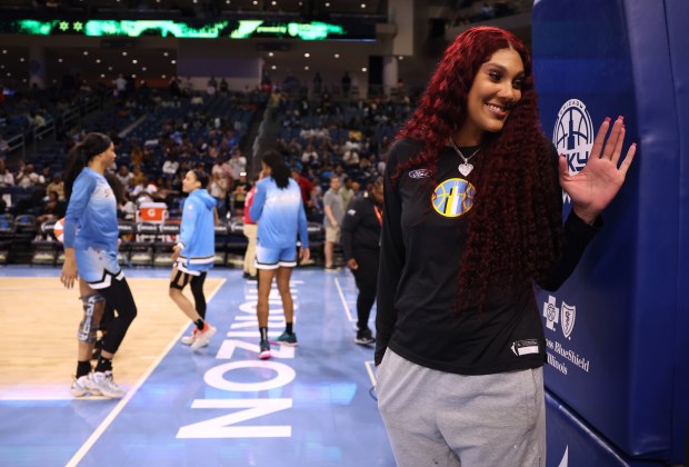 Injured center Kamilla Cardoso waves to fans as the Sky warm up for their home opener against the Connecticut Sun at Wintrust Arena in Chicago on May 25, 2024. (Chris Sweda/Chicago Tribune)