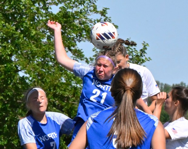 St. Charles North's Kayla Floyd, upper right, wins the header and scores as Wheaton North's Shayne Berner, 21, is too late during the IHSA Class 3A South Elgin Sectional Girls Soccer Final at South Elgin High School in South Elgin, Saturday, May 25, 2024.(Michael Schmidt/For The Aurora Beacon-News)