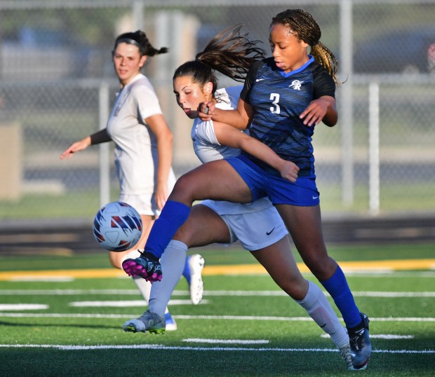 Burlington Central's Mekenzie Rogers (3) tangles with Wheaton Academy's Sydney Younce during the Class 2A Hinsdale South Supersectional game on Tuesday, May 28, 2024, in Darien.(Jon Cunningham/for The Beacon-News)