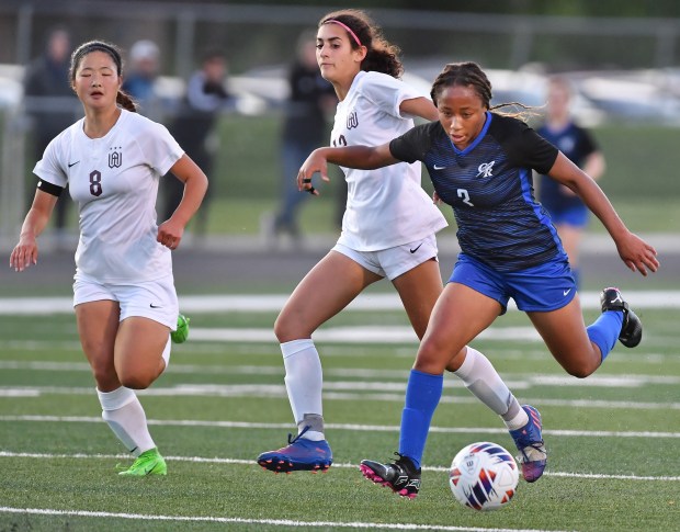 Burlington Central's Mekenzie Rogers (right) takes a shot at the goal against Wheaton Academy during the Class 2A Hinsdale South Supersectional game on Tuesday, May 28, 2024, in Darien.(Jon Cunningham/for The Beacon-News)