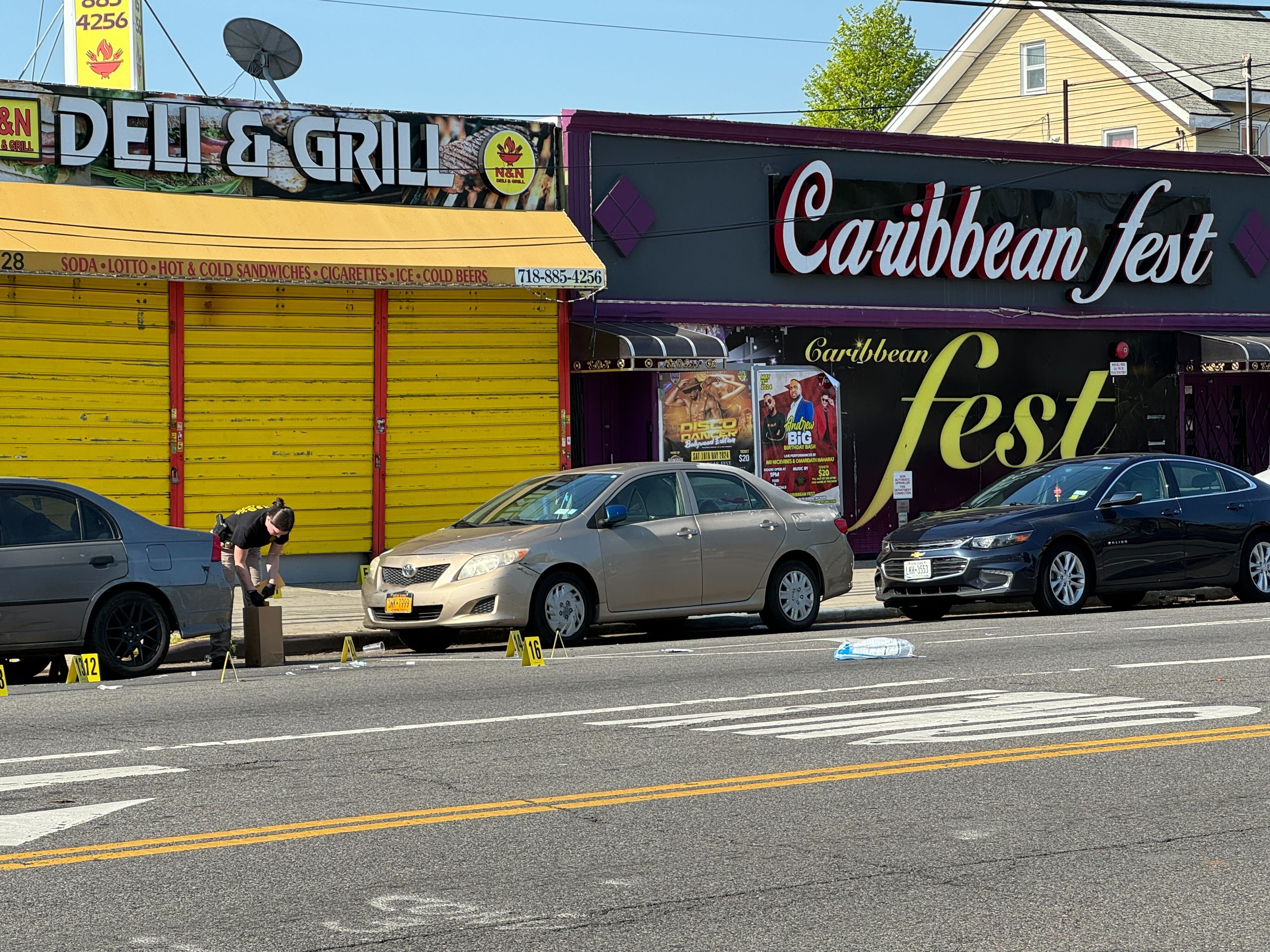 Evidence markers were seen on a street in South Ozone Park after police said a shooting happened there on April 29, 2024.