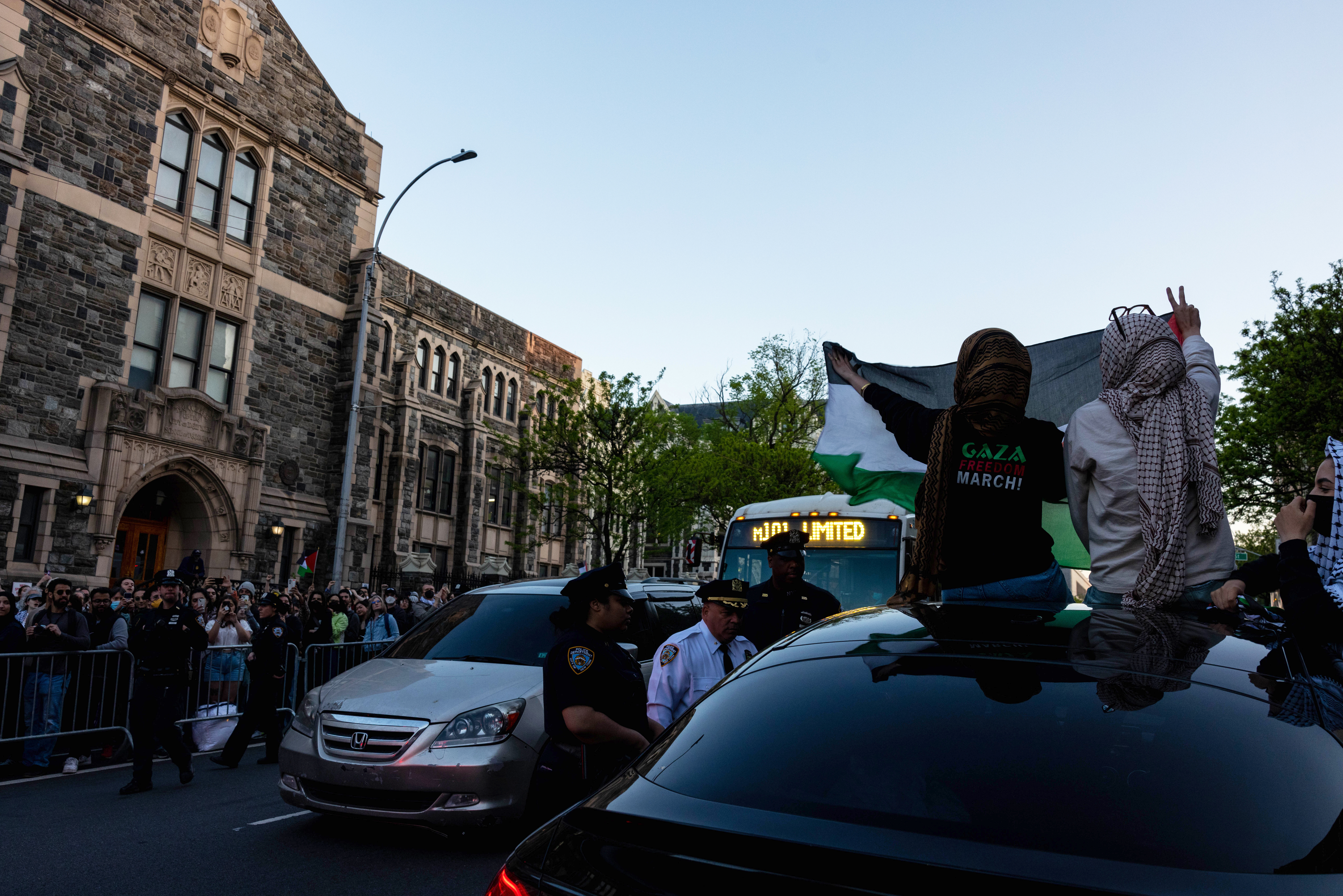 Protestors From CUNY And Columbia Rally One Day After Police Break Up Encampments NEW YORK, NEW YORK - MAY 1: NYPD officers talk to the driver of a car who sped past a pro-Palestinian demonstration outside The City College Of New York (CUNY) one day after police cracked down on protest camps at both Columbia University and CCNY on May 1, 2024 in New York City. A heavy police presence surrounded both campuses on Tuesday and cleared the tent encampments set up by pro-Palestinian protesters. Classes at both schools have been moved virtually to online learning in response to the recent campus unrest.