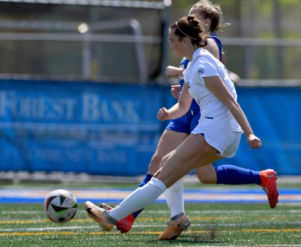 New Trier's Josie Noble (18) winds up and kicks the only goal in the first half of play. Lake Forest's girls soccer team hosted New Trier, Saturday, May 4, 2024. (Rob Dicker/for Pioneer Press)