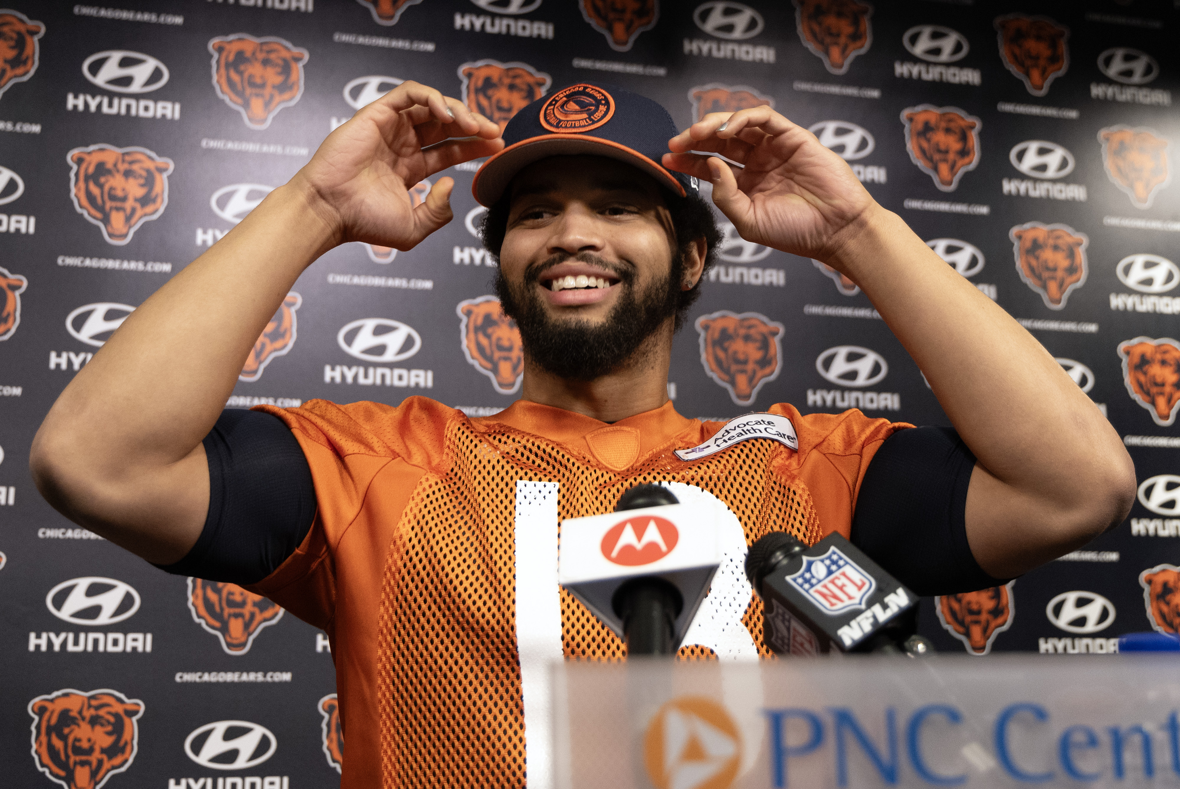 Bears quarterback Caleb Williams greets the media before the start...