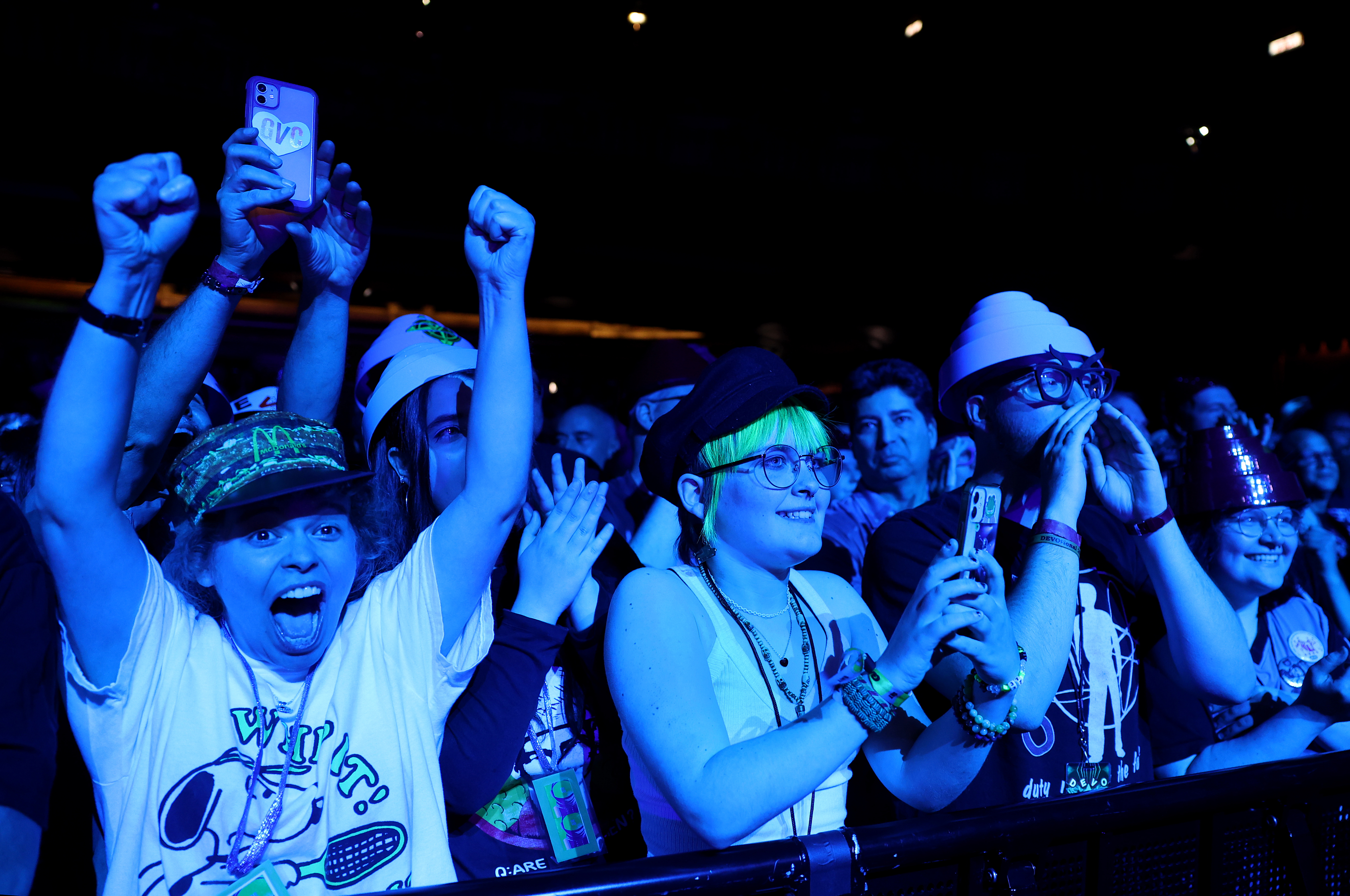 The audience takes in a concert by Devo at the...