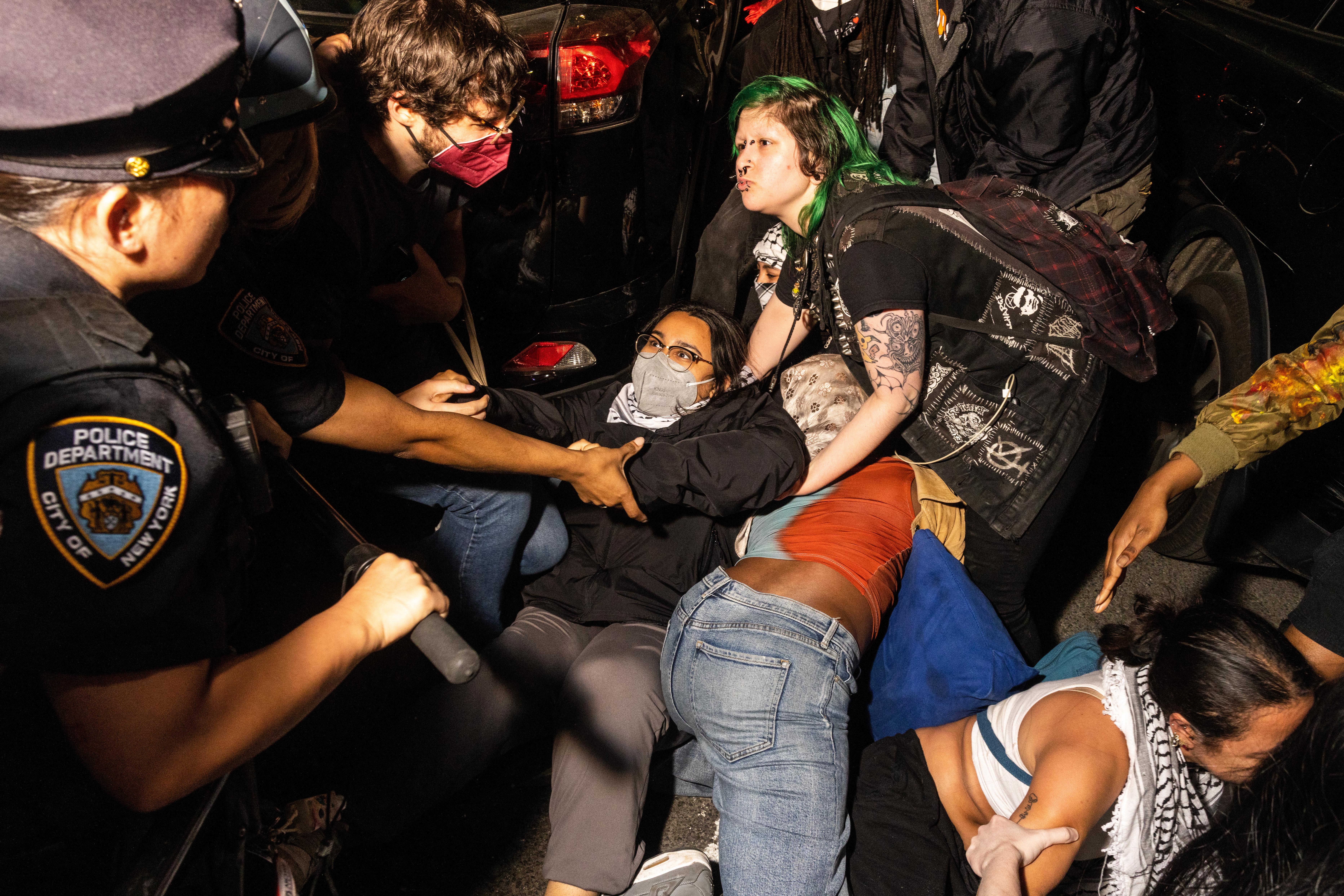 New York City police arrest demonstrators at a pro-Palestine encampment that was being cleared at the Fashion Institute of Technology on May 7, 2024.