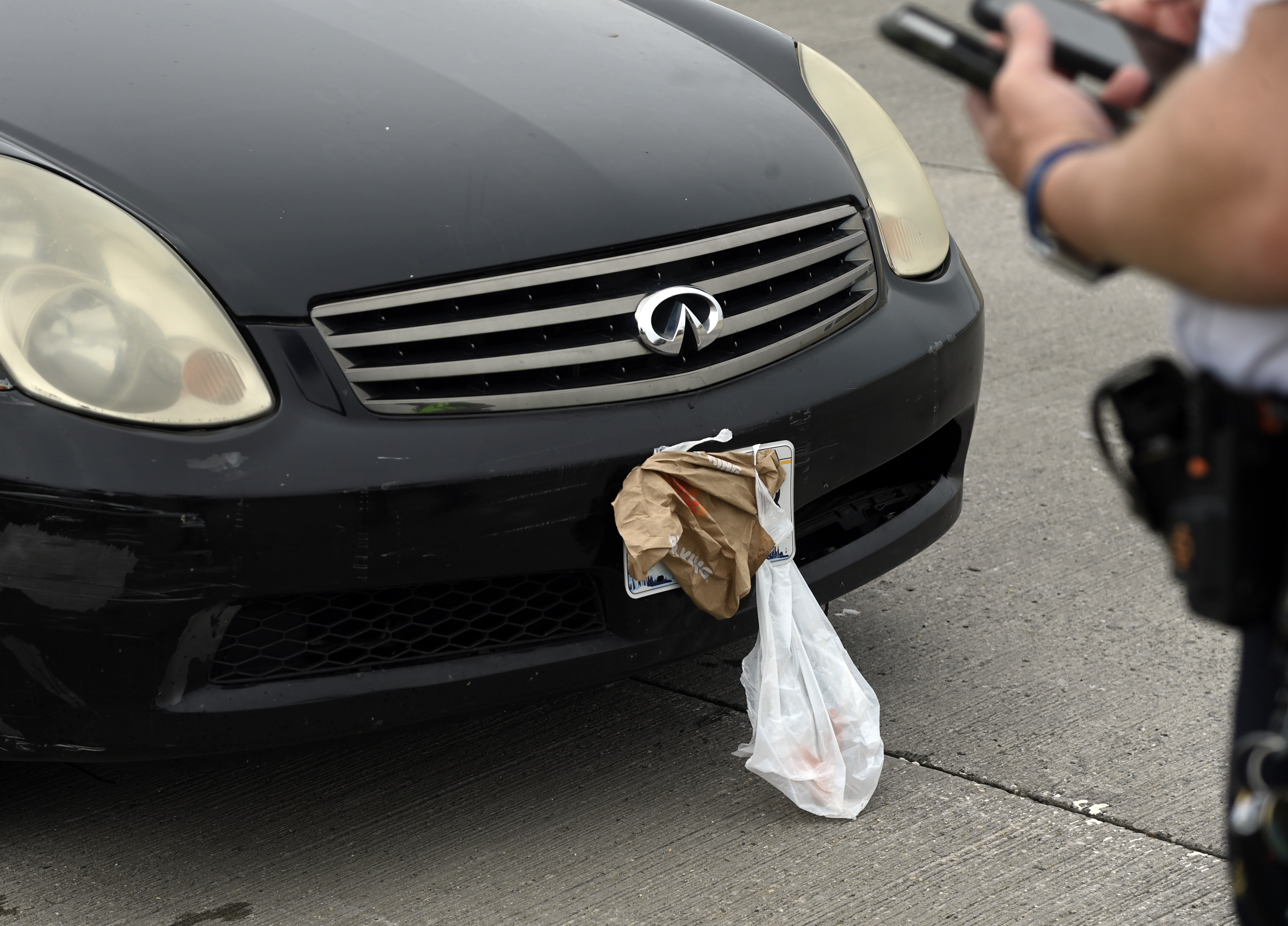 Officials say one of the drivers was blatantly covering their license plate using bags.