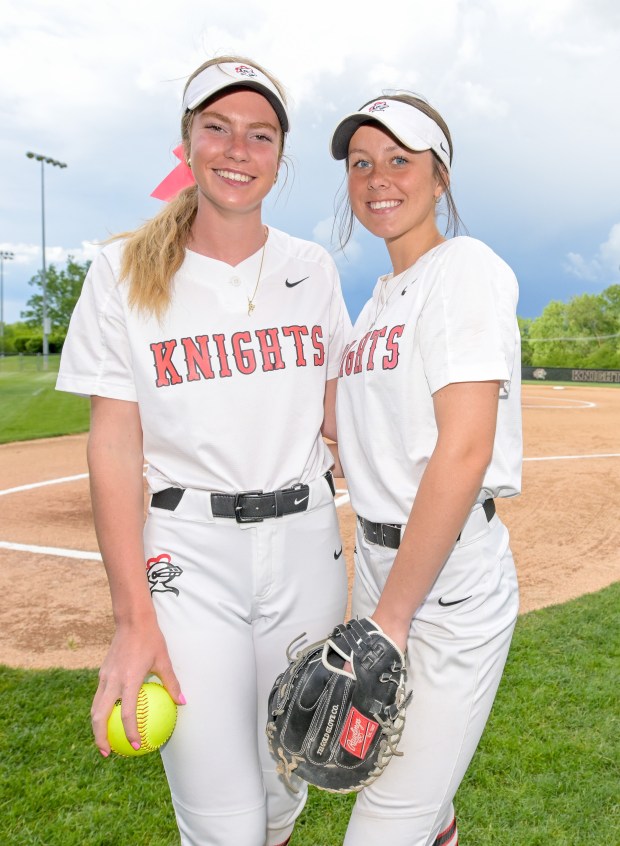 Lincoln-Way Central pitcher Bella Dimitrijevic (13) and catcher Lucy Cameron (4) pose on the diamond, while the storm clouds loom over head, the storm and accompanying lightning lead to the postponement of Class 4A Lincoln-Way Central Sectional semifinals against Lincoln-Way East in New Lenox on Tuesday, May 28, 2024. (Mark Black / for the Daily Southtown)