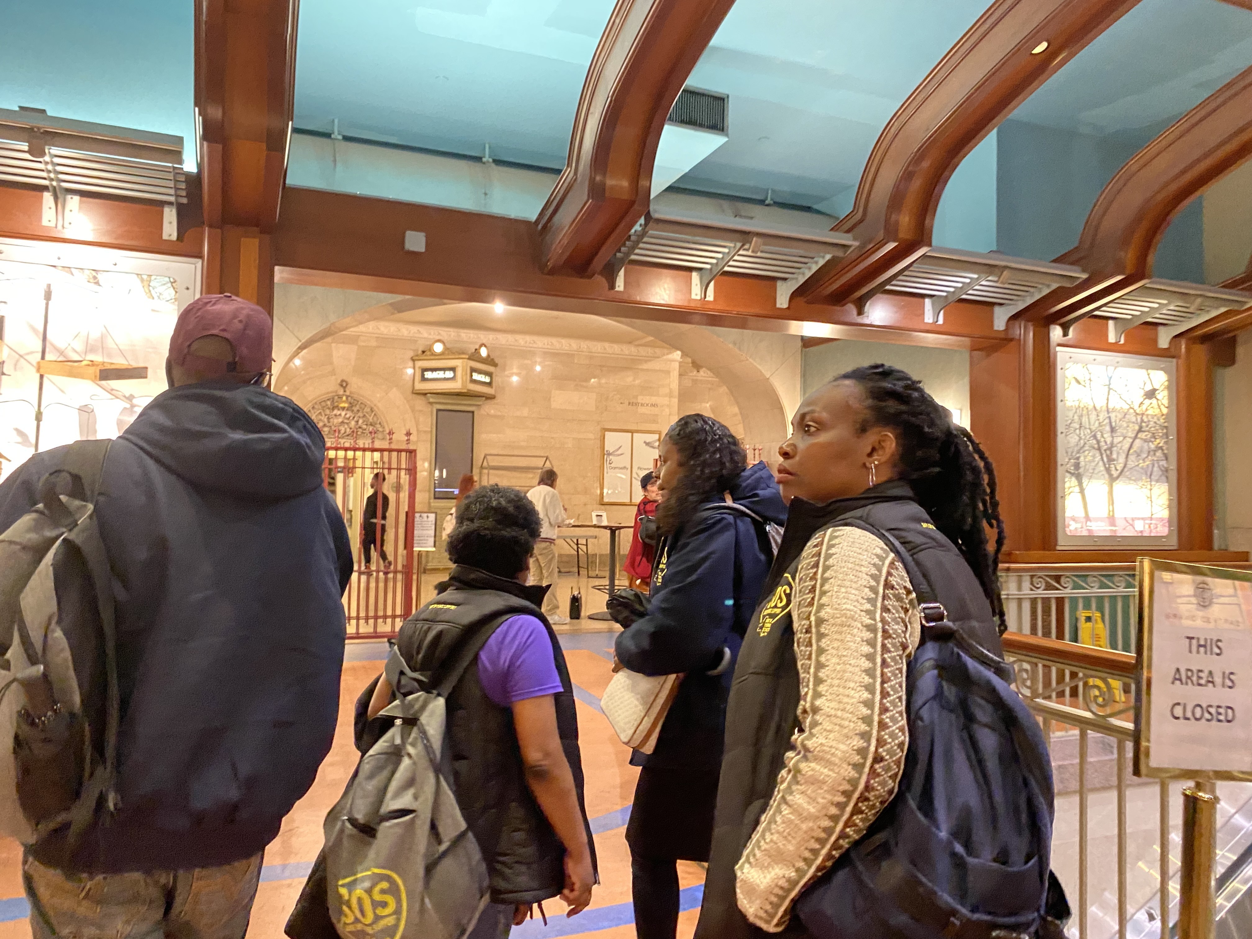 Charisse White, team leader for one of the Safe Options Support teams, directs her team to check back for homeless individuals around the dining areas at Grand Central Station during a two-hour canvassing effort.