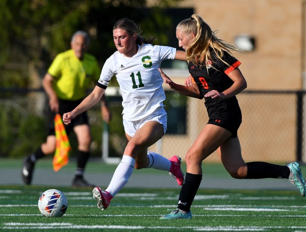 Libertyville's Erin Kelly (8) and Stevenson's Eliana Egeland (11) battle for the ball. Libertyville defeated Stevenson 2-0 in the Class 3A Stevenson Regional championship game, played at Stevenson, Friday, May 17, 2024. (Rob Dicker/for the Lake New-Sun)